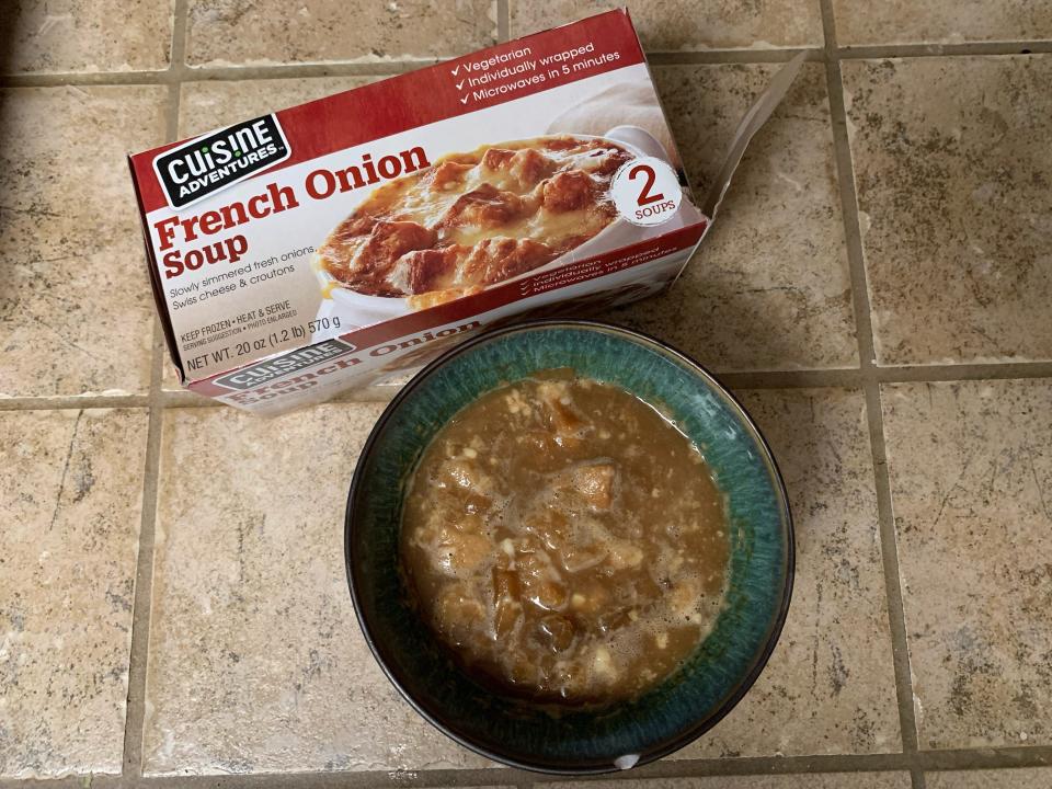 Trader Joe's package of french onion soup beside cooked bowl of it