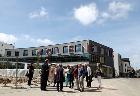 Tourists visit the Brussels district of Molenbeek during a guided tour showing off the area's manufacturing heritage, diverse population and lively market, Belgium, August 13, 2016. Picture taken August 13, 2016. REUTERS/Francois Lenoir