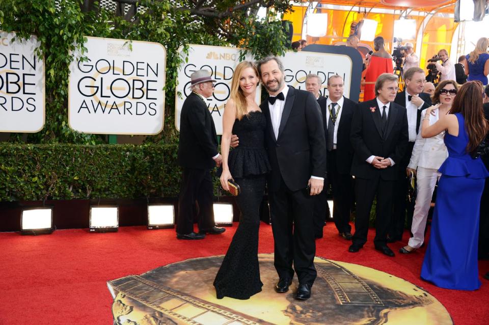 Leslie Mann, left, and Judd Apatow arrive at the 71st annual Golden Globe Awards at the Beverly Hilton Hotel on Sunday, Jan. 12, 2014, in Beverly Hills, Calif. (Photo by Jordan Strauss/Invision/AP)