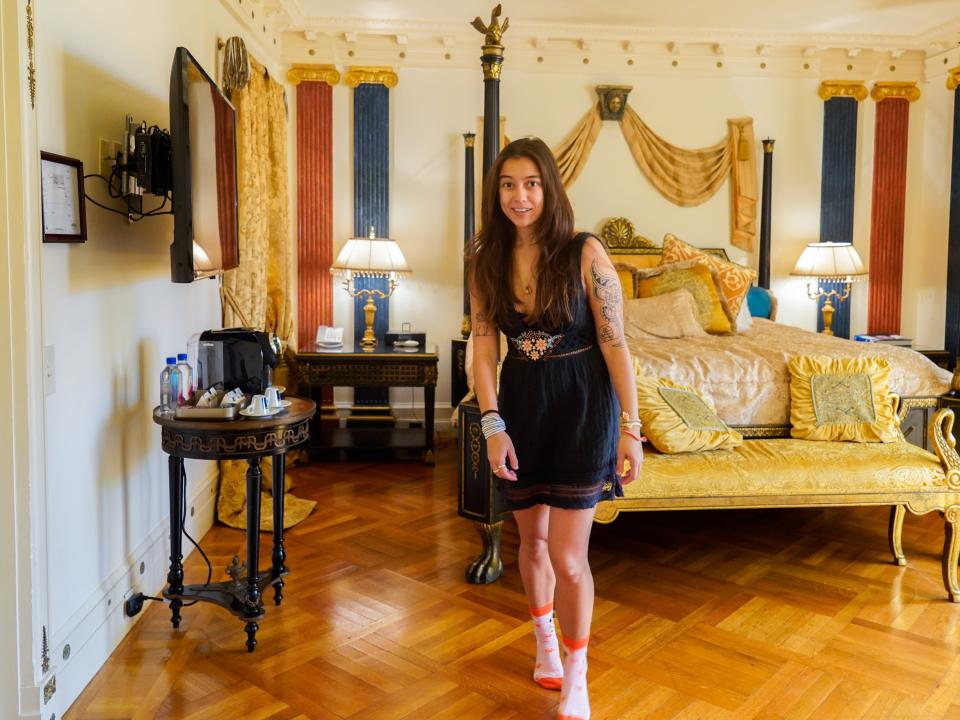 The author stands in the Aurora Suite in the former Versace Mansion