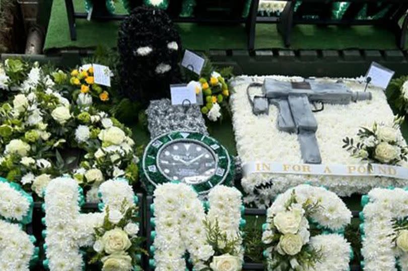 Floral tributes at funeral of Matthew Ferry Laing's Jewellers Smash