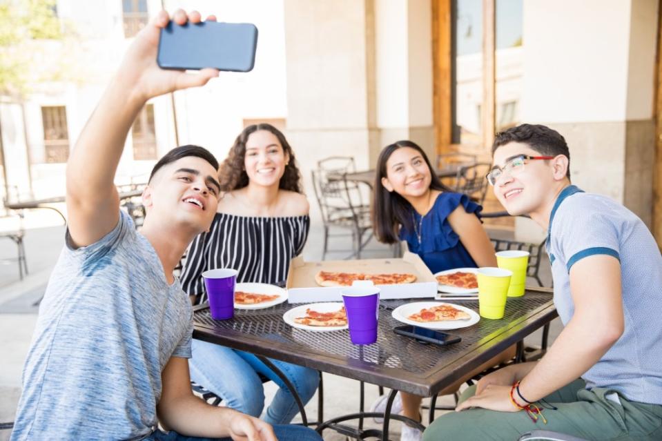 Experts say phones shouldn’t be a dinner table staple. Getty Images/iStockphoto