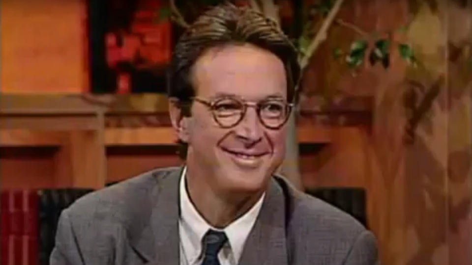 Michael Crichton smiles as he sits as a guest on The Today Show in 1990.