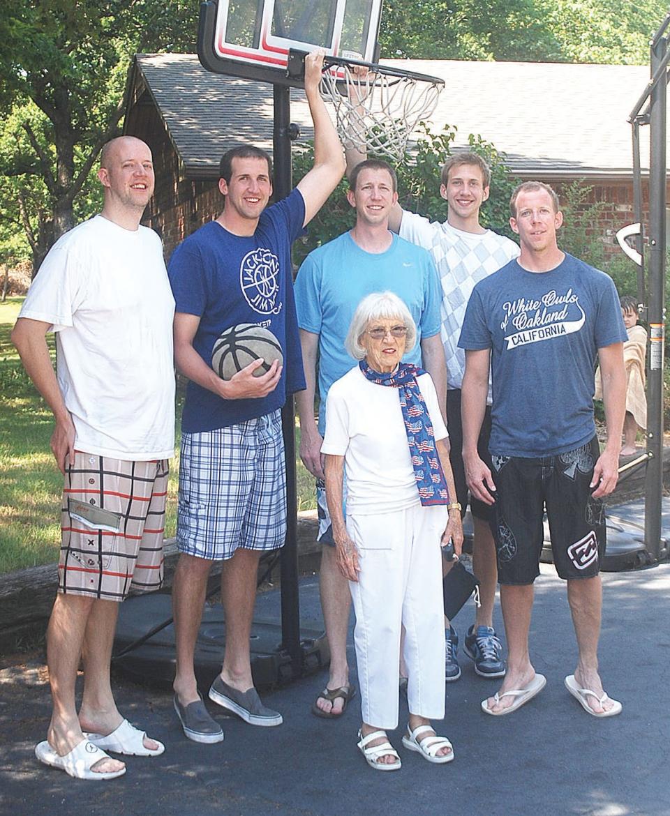 Mildred Moore, front, was one of Bartlesville High School's basketball biggest fans, even as she approached 100 years old, especially when it came to the Hartsock brothers. Moore poses sometimes in the early 2010;s with the brothers in the family's driveway in Bartlesville. The brothers, from left, include Ben, Noah, Daniel, Jakob and Nate. Noah, Daniel, Jakob and Nate all played Bartlesville High hoops and then went on to compete in college basketball. Nate starred at BYU and then played a year of pro ball in Europe.