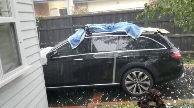 Hail stones fall on a car in Ashburton, Victoria, Australia January 19, 2020 in this picture grab obtained from a social media video.