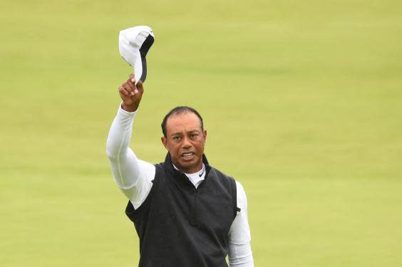 Woods salutes the crowd (AFP/Getty)