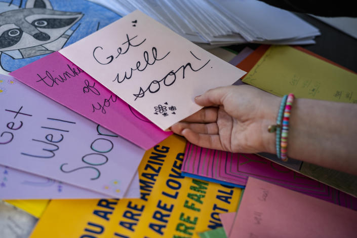 Virginia elementary school teacher Abigail Zwerner looks through some letters and gifts sent to her by people across the country at an undisclosed location in Virginia on March 20, 2023. (Carlos Bernate for NBC News)