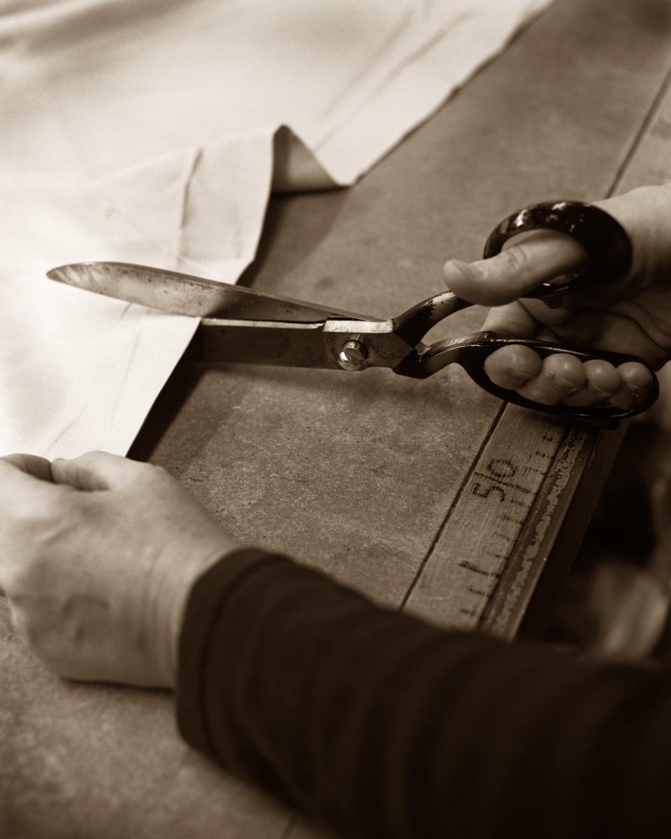 Bertelli cutting fabric at the Florence studio.