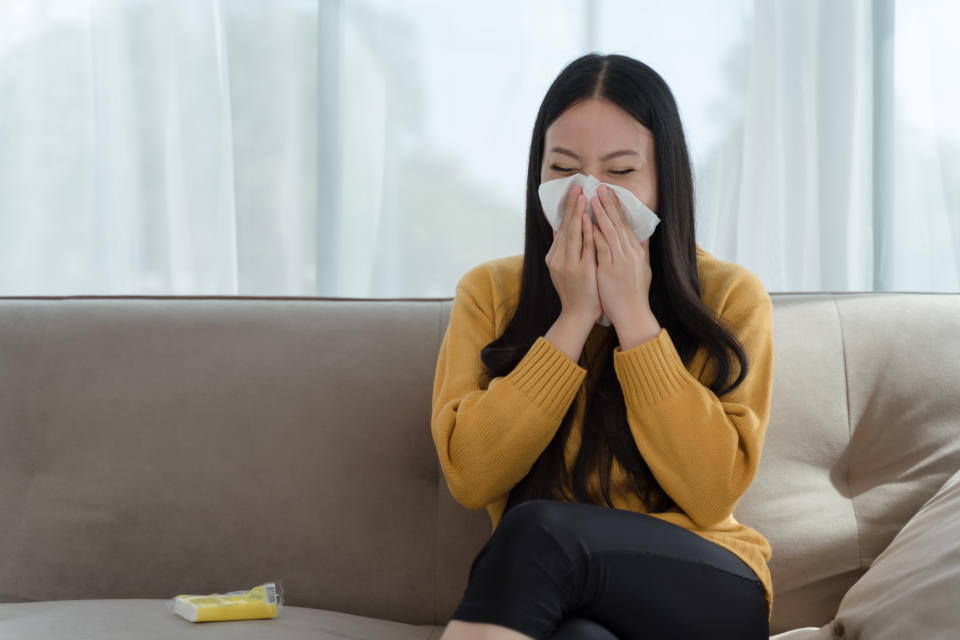 Sick young asian woman sitting on sofa and sneeze with tissue paper at home. Phenylephrine is the main ingredient in many decongestants in the U.S. (Getty) Female blowing nose, coughing or sneezing in tissue at home, suffering from flu. Cold and fever concept