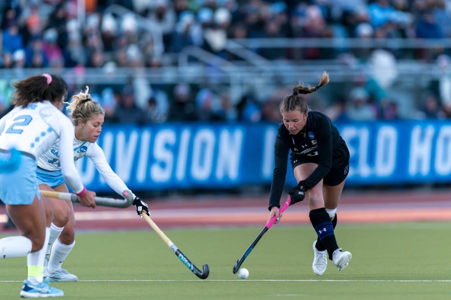 STORRS, CT – NOVEMBER 20: Maddie Zimmer #8 of Northwestern University brings the ball forward during 2022 NCAA Division I Field Hockey Championship game between Northwestern and North Carolina at Sherman Complex on November 20, 2022 in Storrs, Connecticut. (Photo by Andrew Katsampes/ISI Photos/Getty Images).