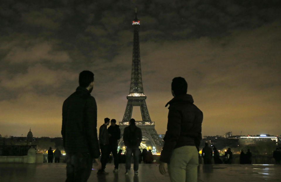 Lights of the Eiffel tower falls dark at midnight