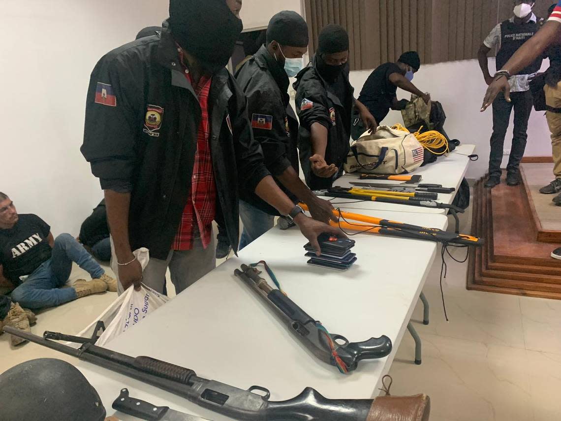 Haitian police display some of the weapons they say they took from men who were involved in the assassination of President Jovenel Moïse.