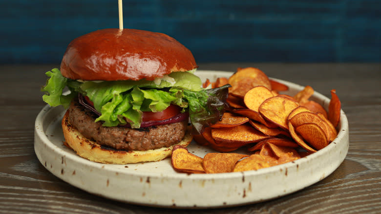 Beyond Meat burger and chips on plate