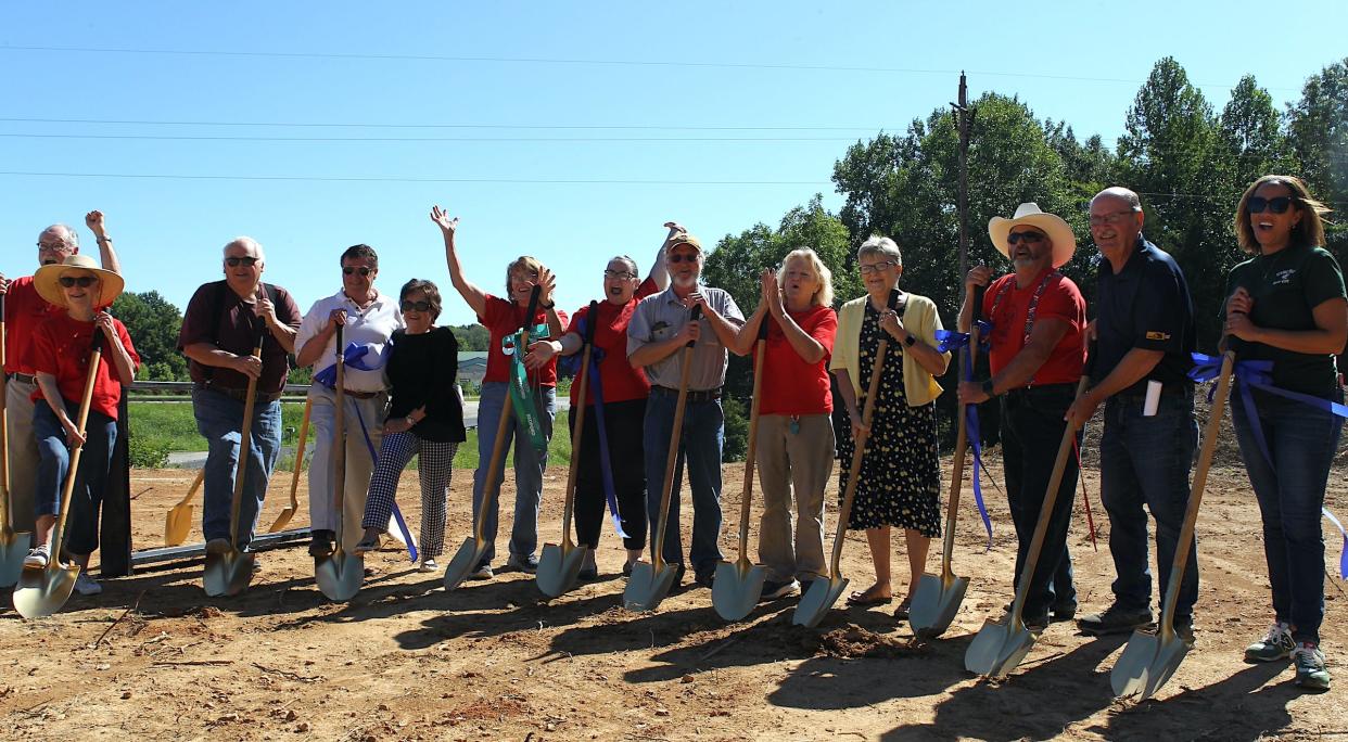 Members of the White River Humane Society Board of Directors, along with other supporters, cheer during the groundbreaking ceremony for the new WRHS facility to-be on Wesley Chapel Road Wednesday Aug. 30, 2023.