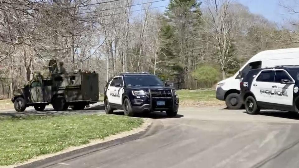 In this image taken from video, police block a road in North Dighton, Mass., Thursday, April 13, 2023. (Michelle R. Smith)