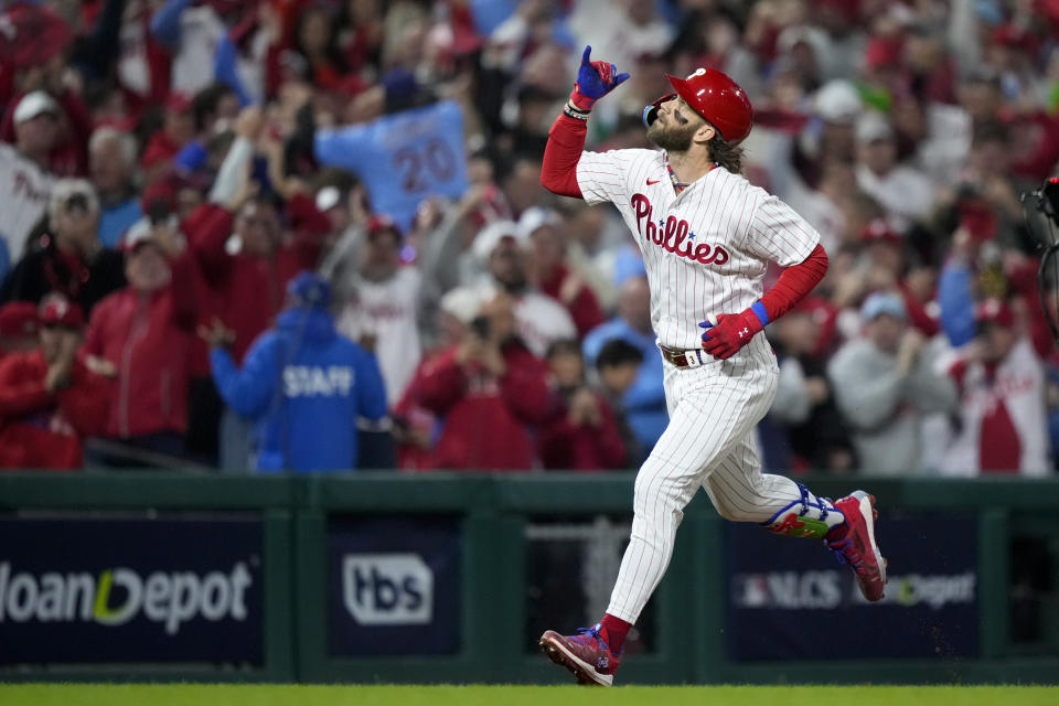 Philadelphia Phillies' Bryce Harper celebrates his home run against the Arizona Diamondbacks during the first inning in Game 1 of the baseball NL Championship Series in Philadelphia, Monday, Oct. 16, 2023. (AP Photo/Matt Slocum)