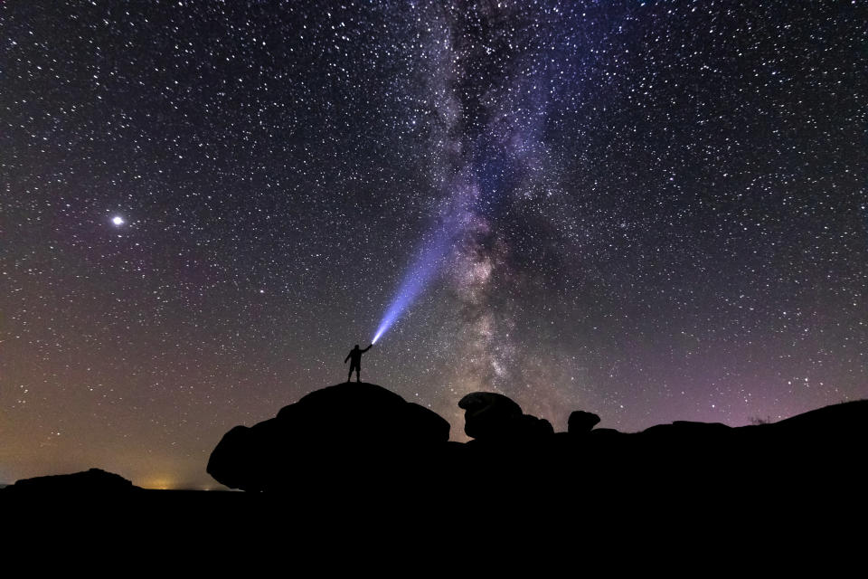 a person looking at stars in the sky