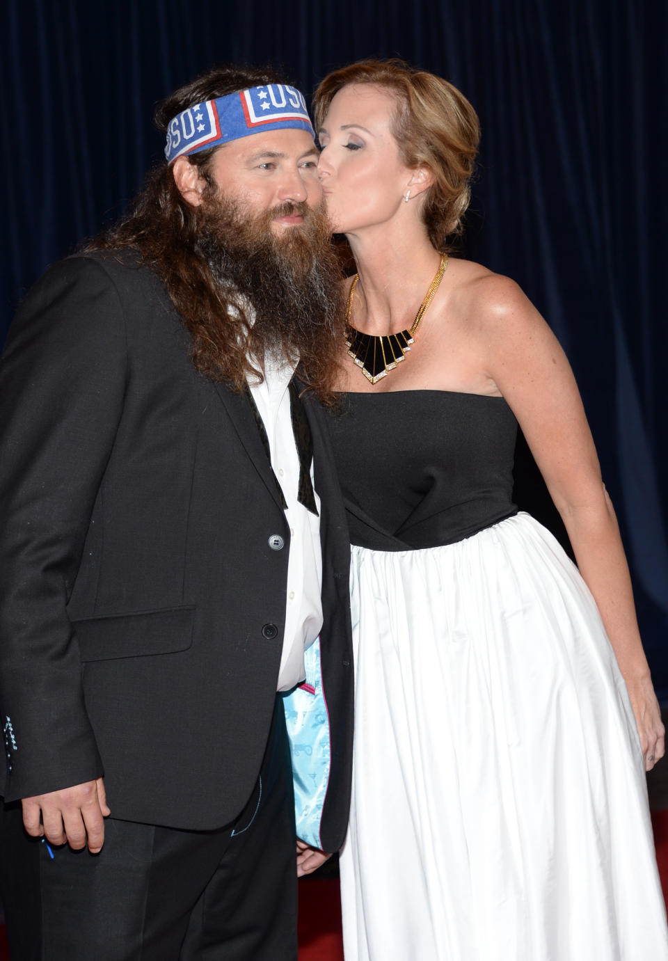 Willie Robertson, left, and Korie Robertson arrive at the White House Correspondents' Association Dinner at the Washington Hilton Hotel, Saturday, May 3, 2014, in Washington. (Photo by Evan Agostini/Invision/AP)