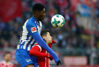 Soccer Football - Bundesliga - Bayern Munich vs Hertha BSC - Allianz Arena, Munich, Germany - February 24, 2018 Hertha Berlin’s Jordan Torunarigha in action with Bayern Munich's Robert Lewandowski REUTERS/Michaela Rehle