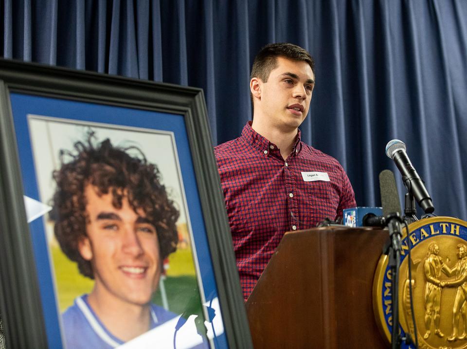 Logan Batson spoke about the need for AEDs on the sidelines while standing next to a photo of his brother during a press conference in Frankfort, KY., on Tuesday afternoon. Batson's brother Cameron lost his life after collapsing Oct. 6, 2010, while playing soccer at Scott High School. Feb. 21, 2023