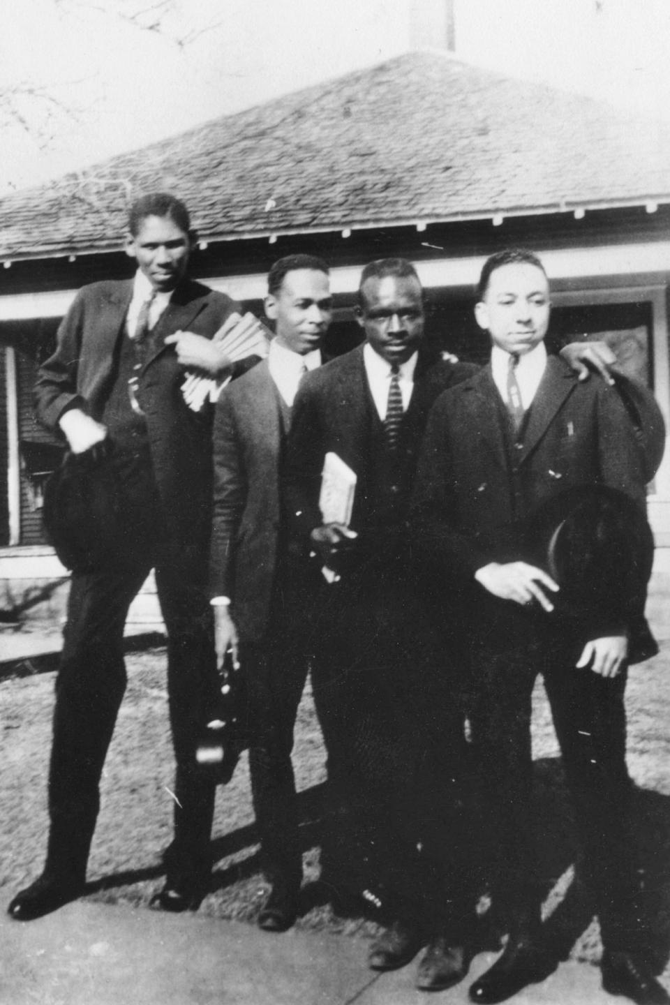 This photo provided by the Department of Special Collections, McFarlin Library, The University of Tulsa shows James T. A. West, an instructor at Booker T. Washington High School and three other Black men. It is believed that the photo was taken in Tulsa, Okla. prior to the Tulsa Race Massacre in 1921. (Department of Special Collections, McFarlin Library, The University of Tulsa via AP)