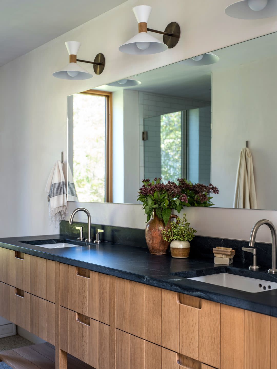 bathroom with soapstone mirror