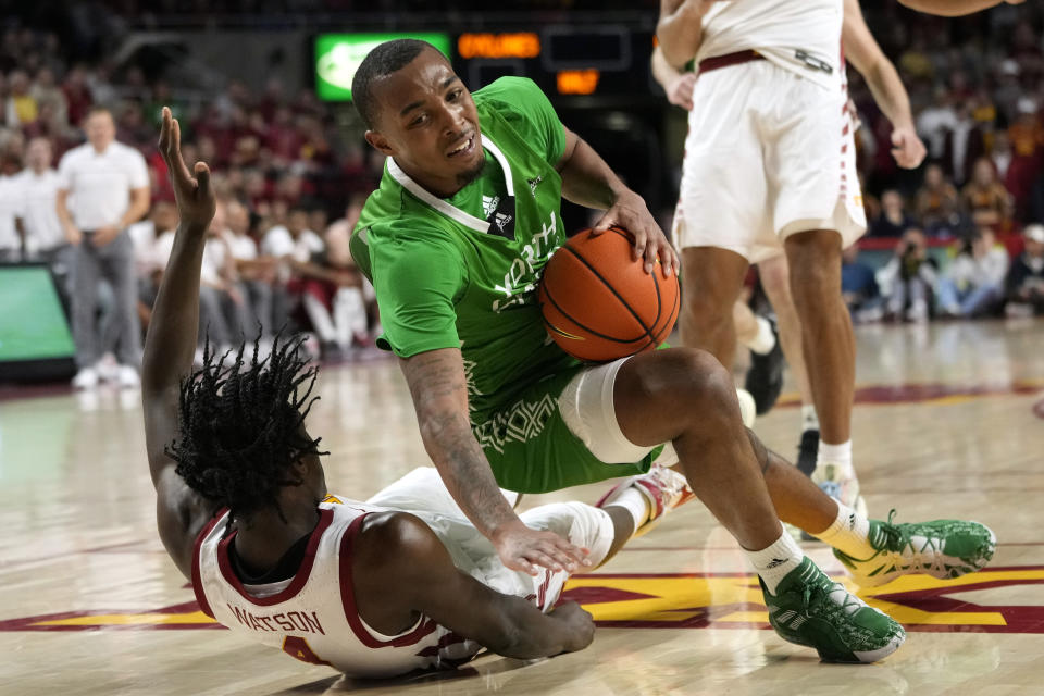 North Dakota forward A'Jahni Levias is fouled by Iowa State guard Demarion Watson (4) during the second half of an NCAA college basketball game, Wednesday, Nov. 30, 2022, in Ames, Iowa. Iowa State won 63-44. (AP Photo/Charlie Neibergall)