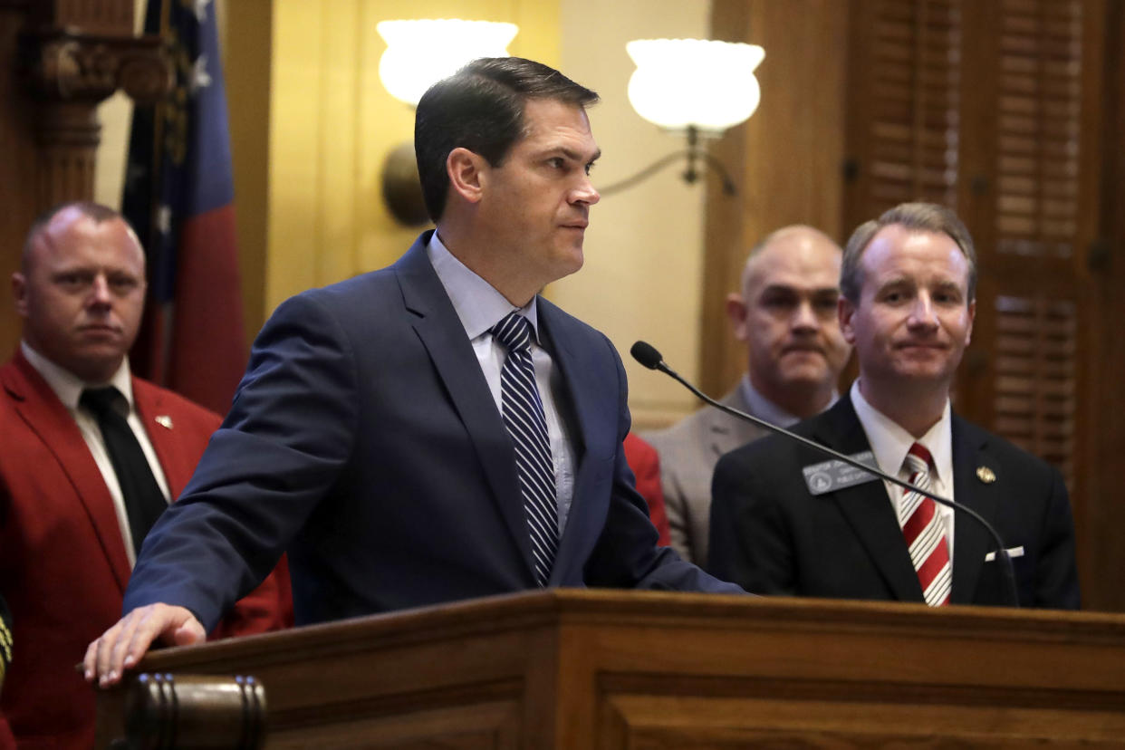 Lt. Gov. Geoff Duncan speaks on the floor of the Georgia state Senate as Sen. John Albers, R-Roswell, looks on.