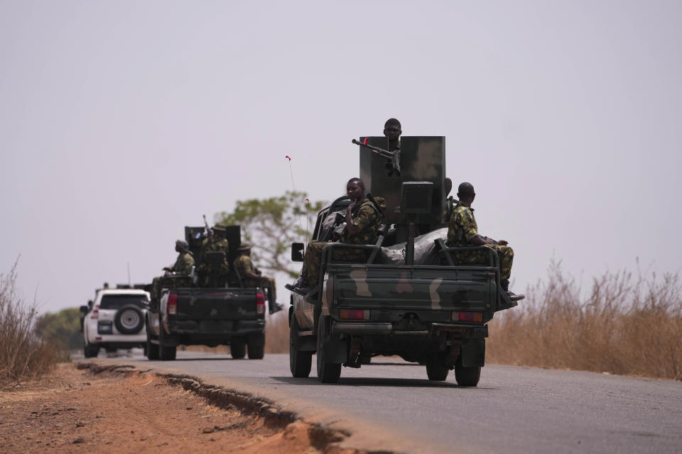 Nigerian army patrol near LEA Primary and Secondary School Kuriga where students were kidnapped in Kuriga, Kaduna, Nigeria, Saturday, March 9, 2024. Security forces swept through large forests in Nigeria's northwest region on Friday in search of nearly 300 children who were abducted from their school a day earlier in the West African nation's latest mass kidnap which analysts and activists blamed on the failure of intelligence and slow security response. (AP Photo/Sunday Alamba)