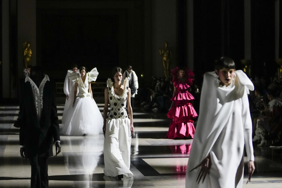 Models wear creations for the Viktor&Rolf Spring-Summer 2022 Haute Couture fashion collection, in Paris, Wednesday, Jan. 26, 2022. (AP Photo/Thibault Camus)