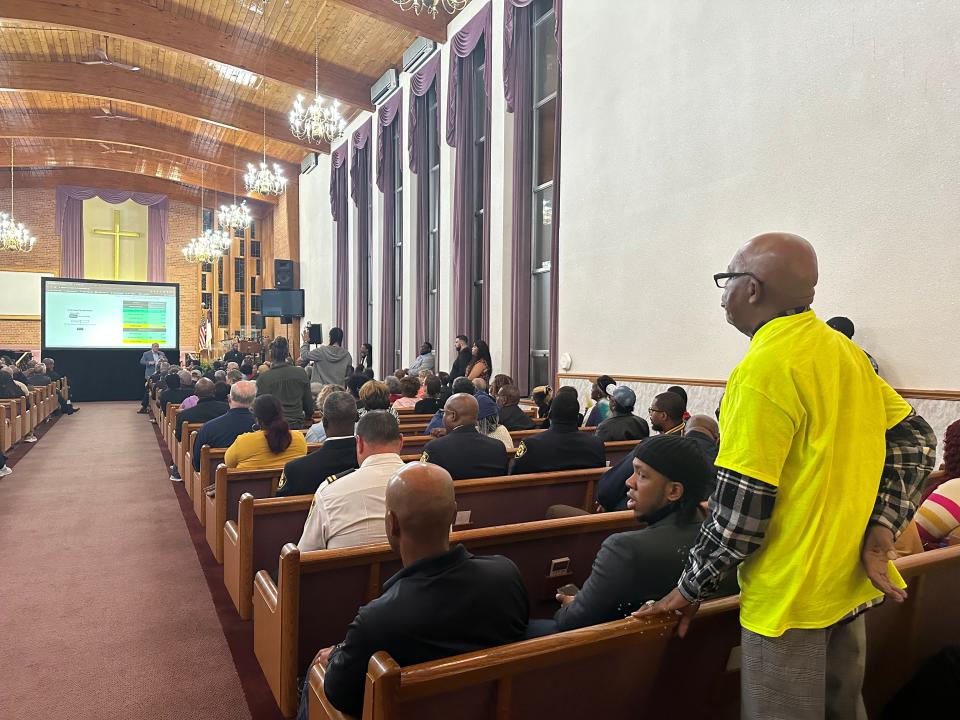 Detroit resident Ernest Johnson watches city officials use a new online tool that shows the differences in homeowners' taxes if the proposed Land Value Tax plan were in place today. The tool allows residents to plug in their property information to see an estimated change in their taxes. Oct. 26, 2023.