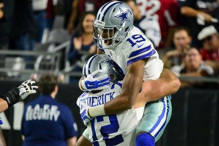 Sep 25, 2017; Glendale, AZ, USA; Dallas Cowboys wide receiver Brice Butler (19) celebrates with center Travis Frederick (72) after scoring a touchdown in the second half against the Arizona Cardinals at University of Phoenix Stadium. Mandatory Credit: Matt Kartozian-USA TODAY Sports