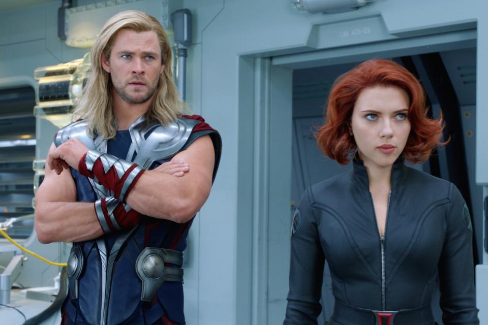 Chris Hemsworth as Thor and Scarlett Johansson as Black Widow in a modern and sleek science-fiction setting from a movie scene