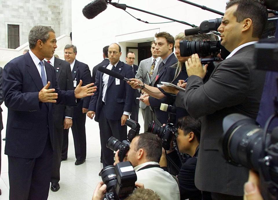 US President George W. Bush (L) talks to reporters at the British Museum in London on July 19, 2001.