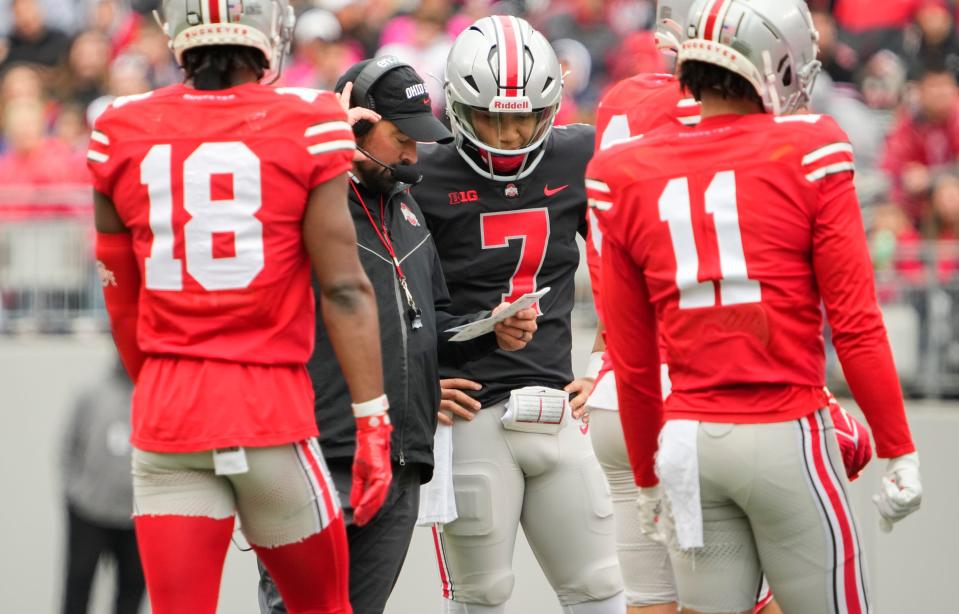 Ohio State Buckeyes quarterback C.J. Stroud (7) talks to  head coach Ryan Day during the spring football game at Ohio Stadium in Columbus on April 16, 2022.