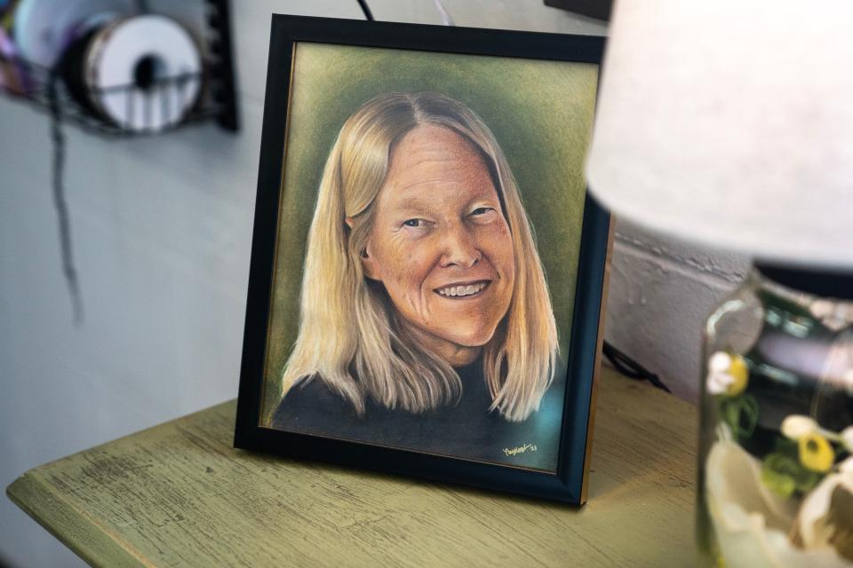 A portrait of Jenn Drake's mom Jane Mescher sits on display in her flower shop.