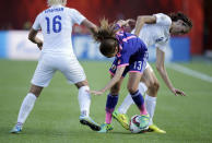 Jul 1, 2015; Edmonton, Alberta, CAN; Japan midfielder Rumi Utsugi (13) fights for the ball against England midfielder Katie Chapman (16) and forward Jill Scott (8) during the second half in the semifinals of the FIFA 2015 Women's World Cup at Commonwealth Stadium. Mandatory Credit: Erich Schlegel-USA TODAY Sports