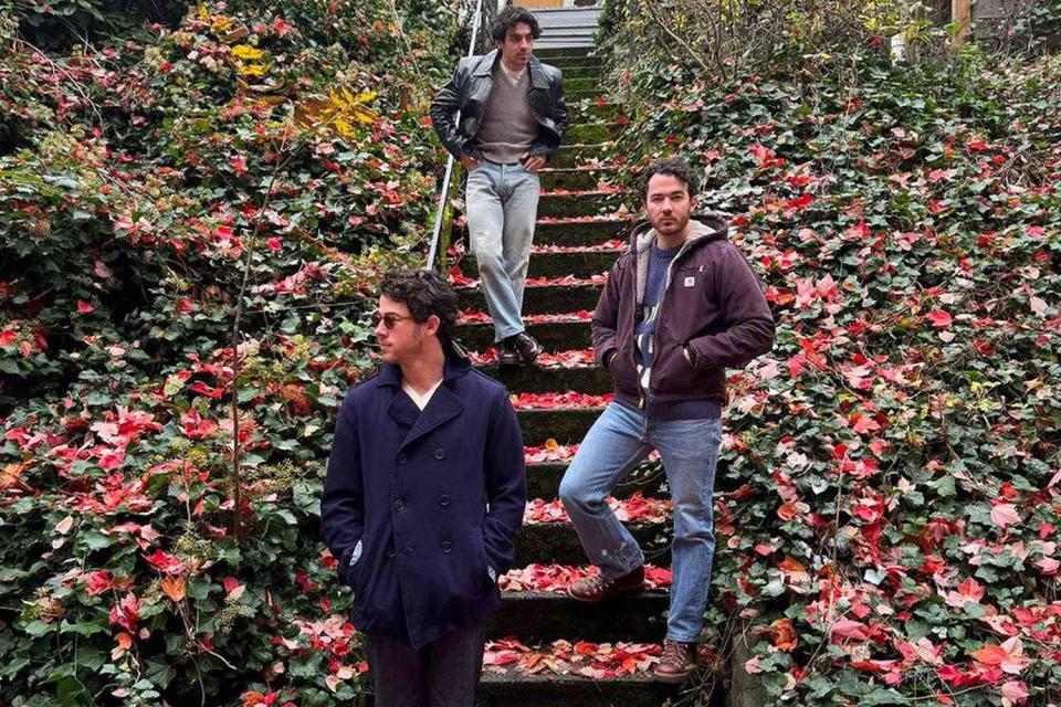 <p>Jonas Brothers/Instagram</p> From left: Nick, Joe and Kevin Jonas pose surrounded by fall leaves.