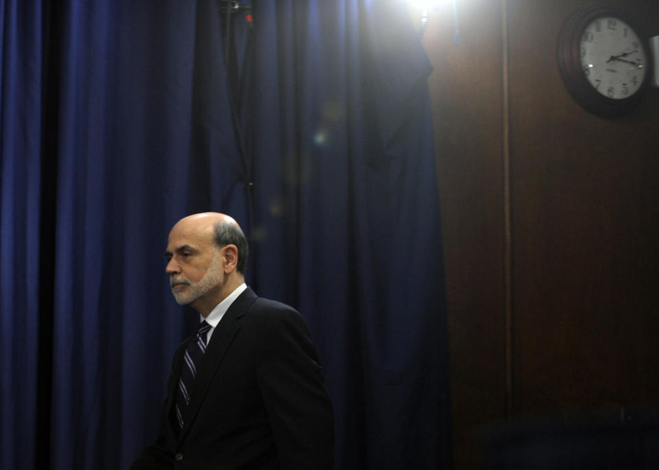 FILE - In this Wednesday, April 25, 2012, file photo, Federal Reserve Chairman Ben Bernanke arrives for a news conference at the Federal Reserve in Washington. The tumultuous Ben Bernanke era at the Federal Reserve moves toward its close with the final policy meeting of his eight-year tenure scheduled for the last week of January 2014. (AP Photo/Susan Walsh, File)