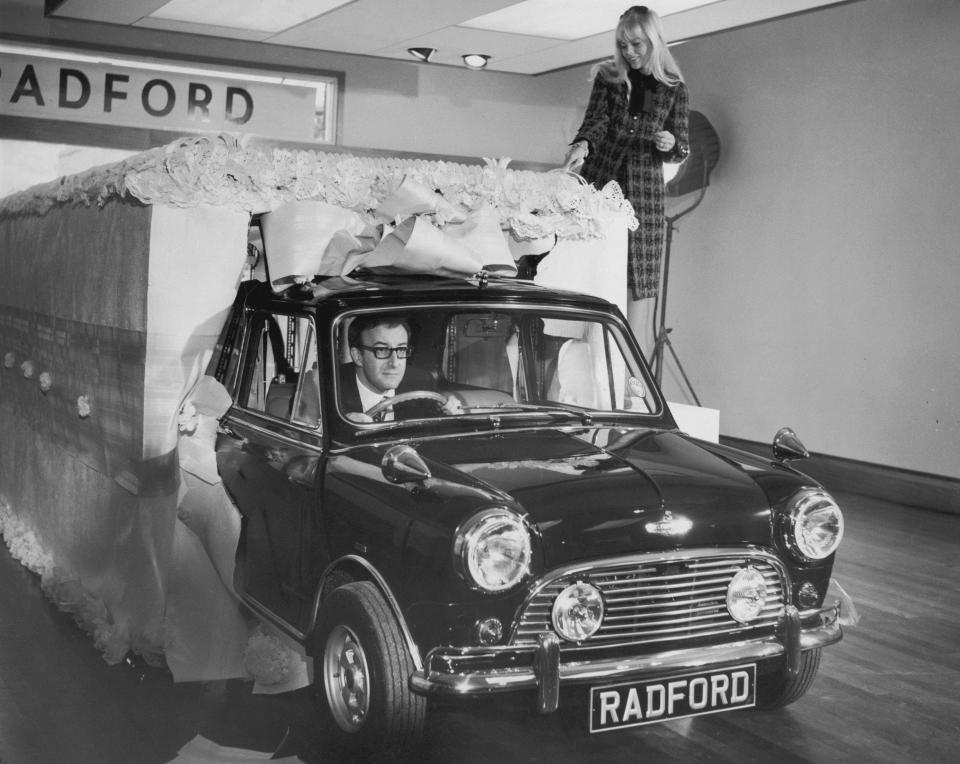 Actor and comedian Peter Sellers drives the luxury mini he had had specially made for his wife, Britt Ekland in 1965 - Hulton Archive 