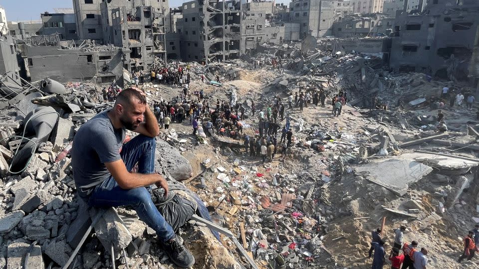 A man looks on as Palestinians search for casualties a day after Israeli strikes on houses in Jabalia refugee camp in the northern Gaza Strip, November 1. - Mohammed Al-Masri/Reuters