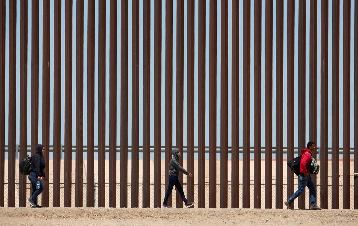 Migrants await to be processed at gate 40 of the border wall after having crossed the Rio Grande from Ciudad Juarez in hopes of turning themselves in with the intention of seeking asylum. Omar Ornelas/USA TODAY NETWORK