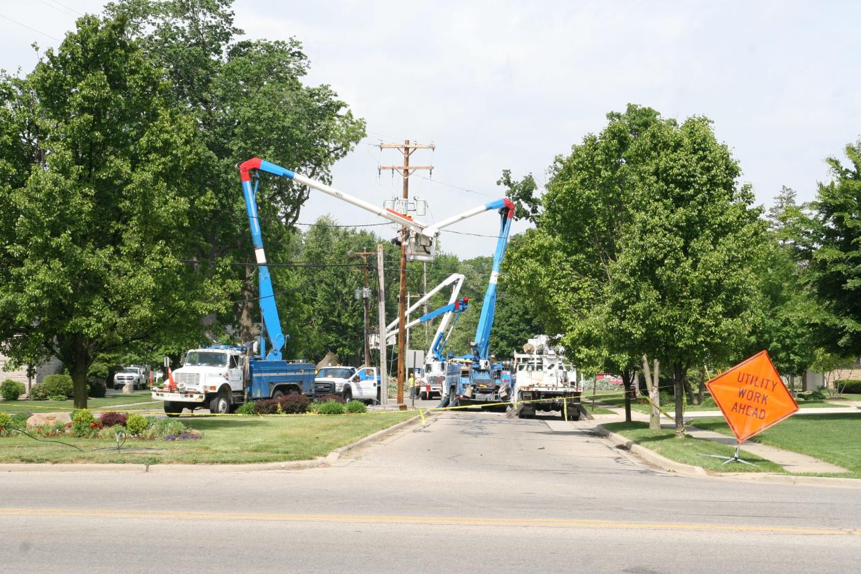 Consumers Energy crews work to restore power May 31, 2013, in Tecumseh.