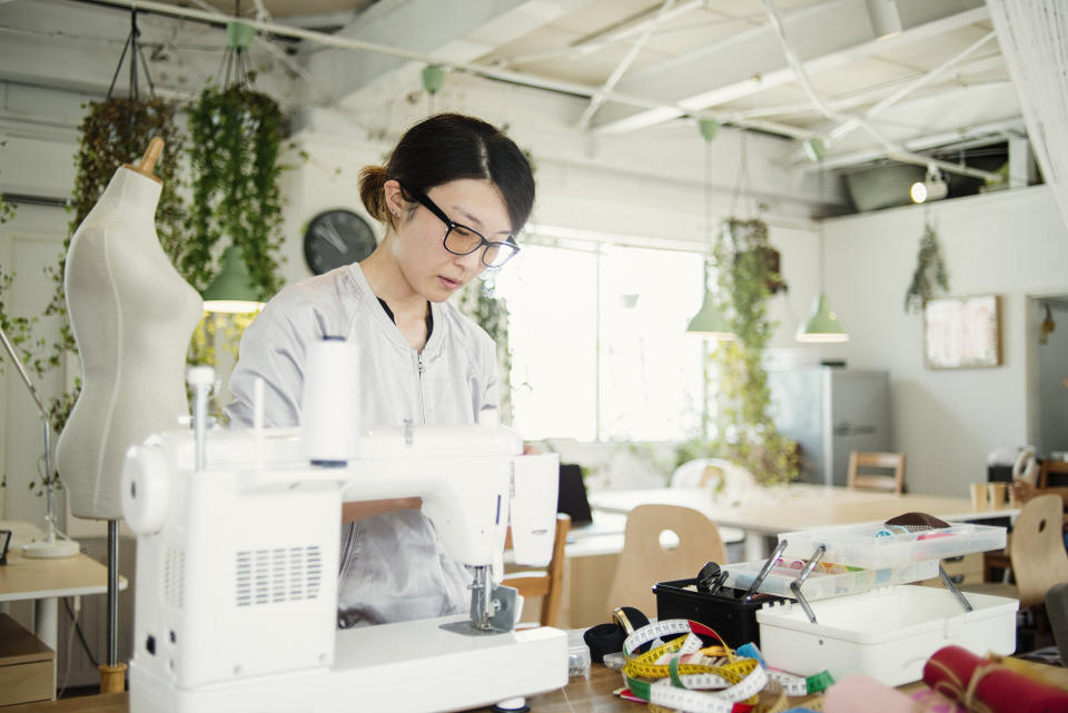 Japanese fashion designer working in studio. (PHOTO: Getty Images)