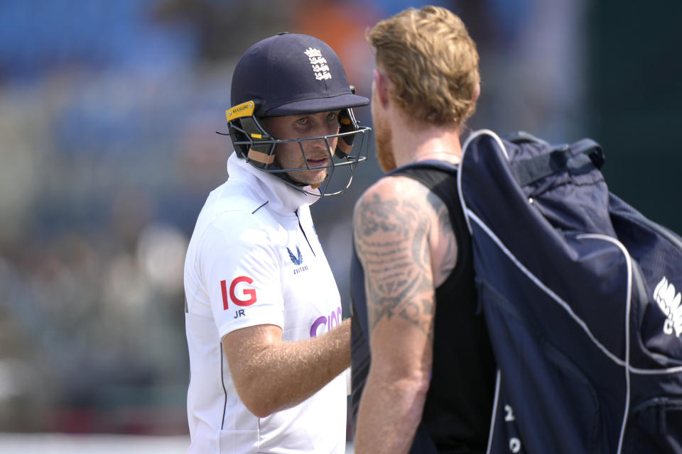 England's Joe Root, left, who is now England's leading test run-scorer. is congratulated by Ben Stokes as he walks off the field on the lunch break during the third day of the first test cricket match between Pakistan and England, in Multan, Pakistan, Wednesday, Oct. 9, 2024. (AP Photo/Anjum Naveed)