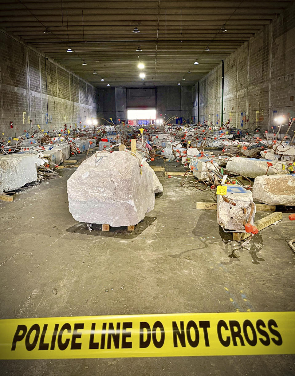 In this photo released by The National Institute of Standards and Technology on Wednesday, June 15, 2022, physical evidence from both the collapsed and imploded sections of Champlain Towers South is stored in a secure warehouse in Miami-Dade County, where it has been cataloged and evaluated by members of the National Construction Safety Team investigating the June 24, 2021, collapse. The federal investigation into the deadly collapse of a Florida beachfront condominium building is entering a new phase that involves cutting and drilling into concrete and steel to determine what role they played in the disaster, officials said Wednesday. (The National Institute of Standards and Technology via AP)