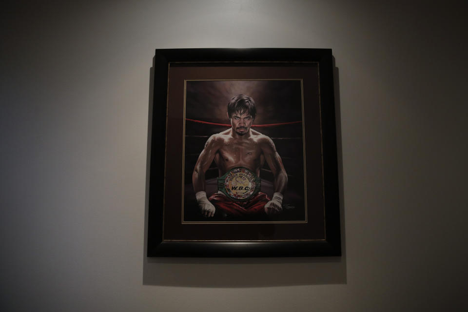 FILE - In this Jan. 14, 2019, file photo, a framed portrait of boxer Manny Pacquiao hangs in the foyer of his home in Los Angeles. A spokesman for Pacquiao says the famed fighter's Los Angeles home was robbed at about the time he was in the ring with rival Adrien Broner in Las Vegas. Spokesman Mike Quinn confirmed the burglary to NBC News. Los Angeles police said a burglary was reported about 4:15 p.m. Sunday, Jan. 20, 2019. in the Larchmont neighborhood. (AP Photo/Jae C. Hong, File)