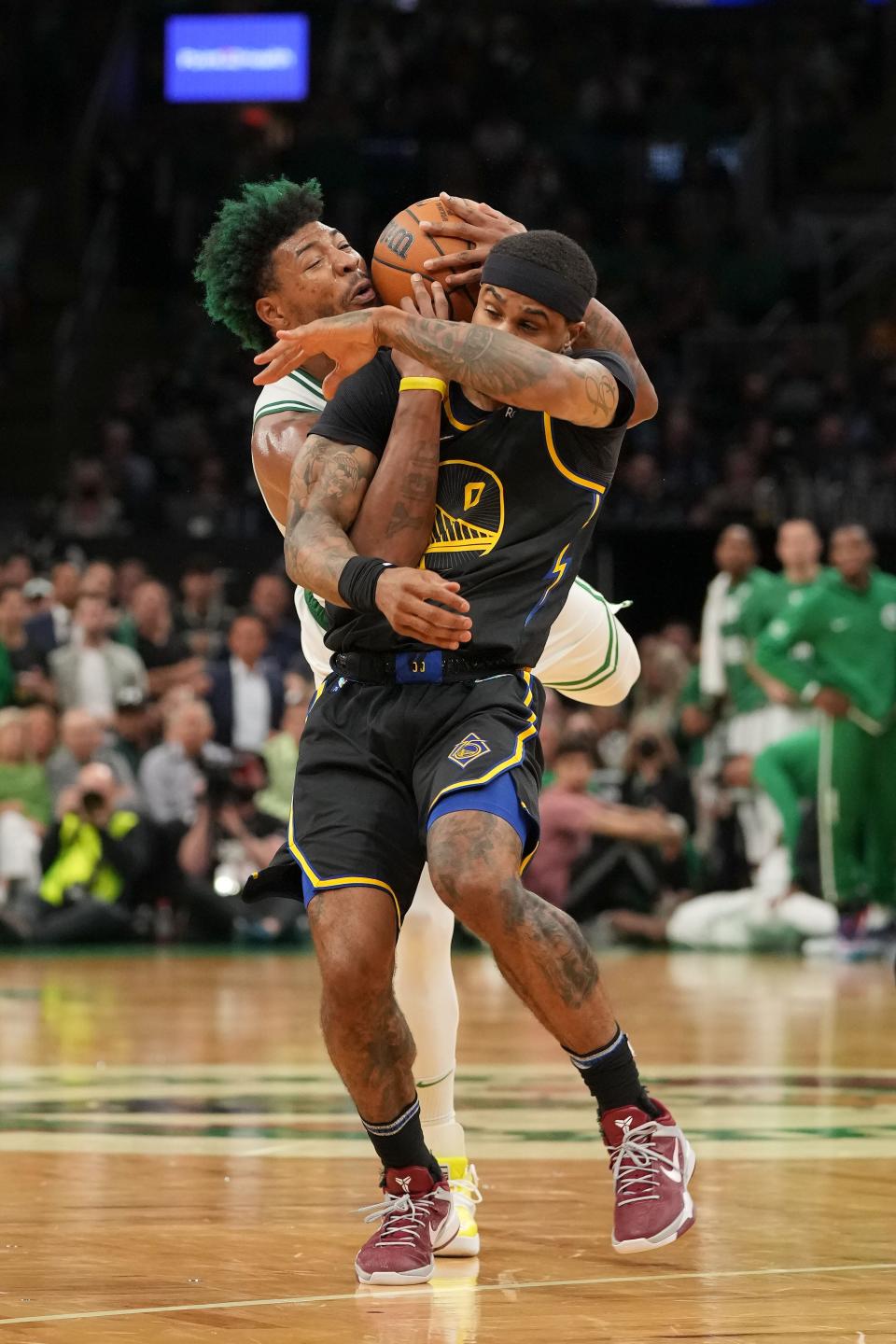 Game 3: Celtics guard Marcus Smart (36) ties up Warriors guard Gary Payton II (0) for possession during the second half.