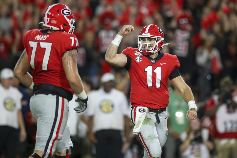 Sep 21, 2019; Athens, GA, USA; Georgia Bulldogs quarterback Jake Fromm (11) celebrates with offensive tackle Cade Mays (77)  after a touchdown against the Notre Dame Fighting Irish in the second quarter at Sanford Stadium. Mandatory Credit: Brett Davis-USA TODAY Sports