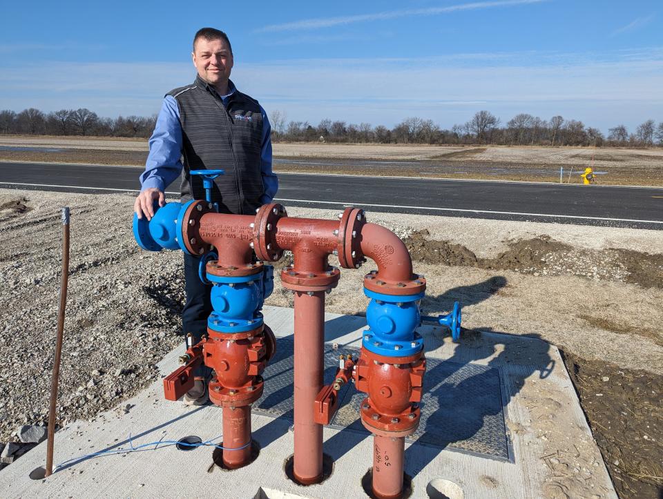 Bob Gross, Fremont's Economic Development Director, stands behind new pipeline in the Harold P. Young Industrial Park, a shovel-ready site for business relocations and expansions.